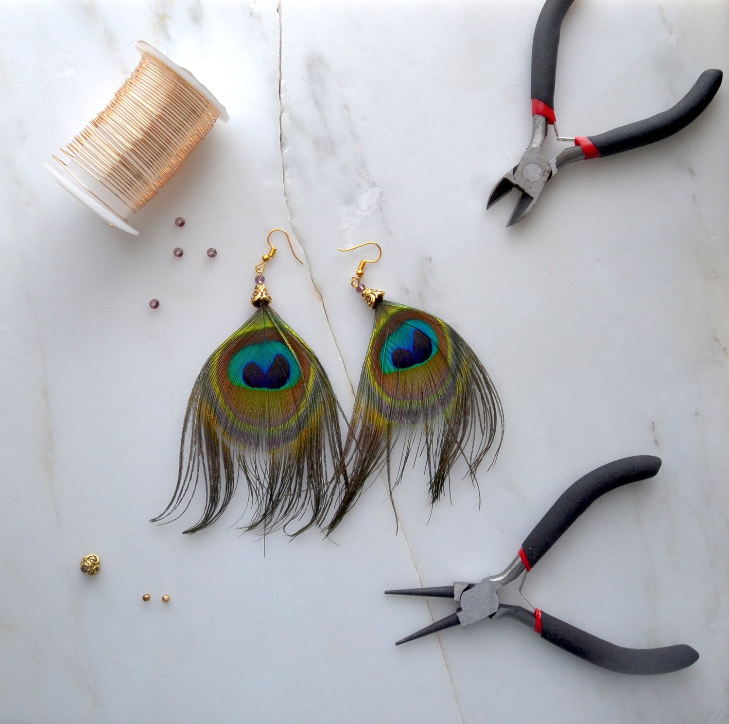 Upgrade Your Jewelry With 13 Unique DIY Earrings 11 earrings diy peacock earrigs thepaperhaunt